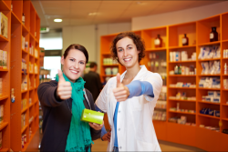customer and pharmacist showing thumbs up